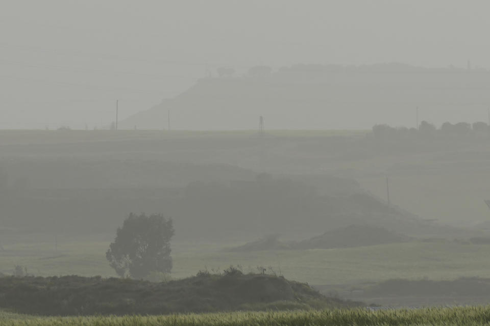 Haze hangs over the fields outskirt of capital Nicosia, in the southeast Mediterranean island of Cyprus, on Monday, April 4, 2022. The U.N. health agency says nearly everybody in the world breathes air that doesn't meet its standards for air quality. The World Health Organization is calling for more action reduce fossil-use use that generate pollutants that cause respiratory and blood-flow problems and lead to millions of preventable deaths each year. (AP Photo/Petros Karadjias)