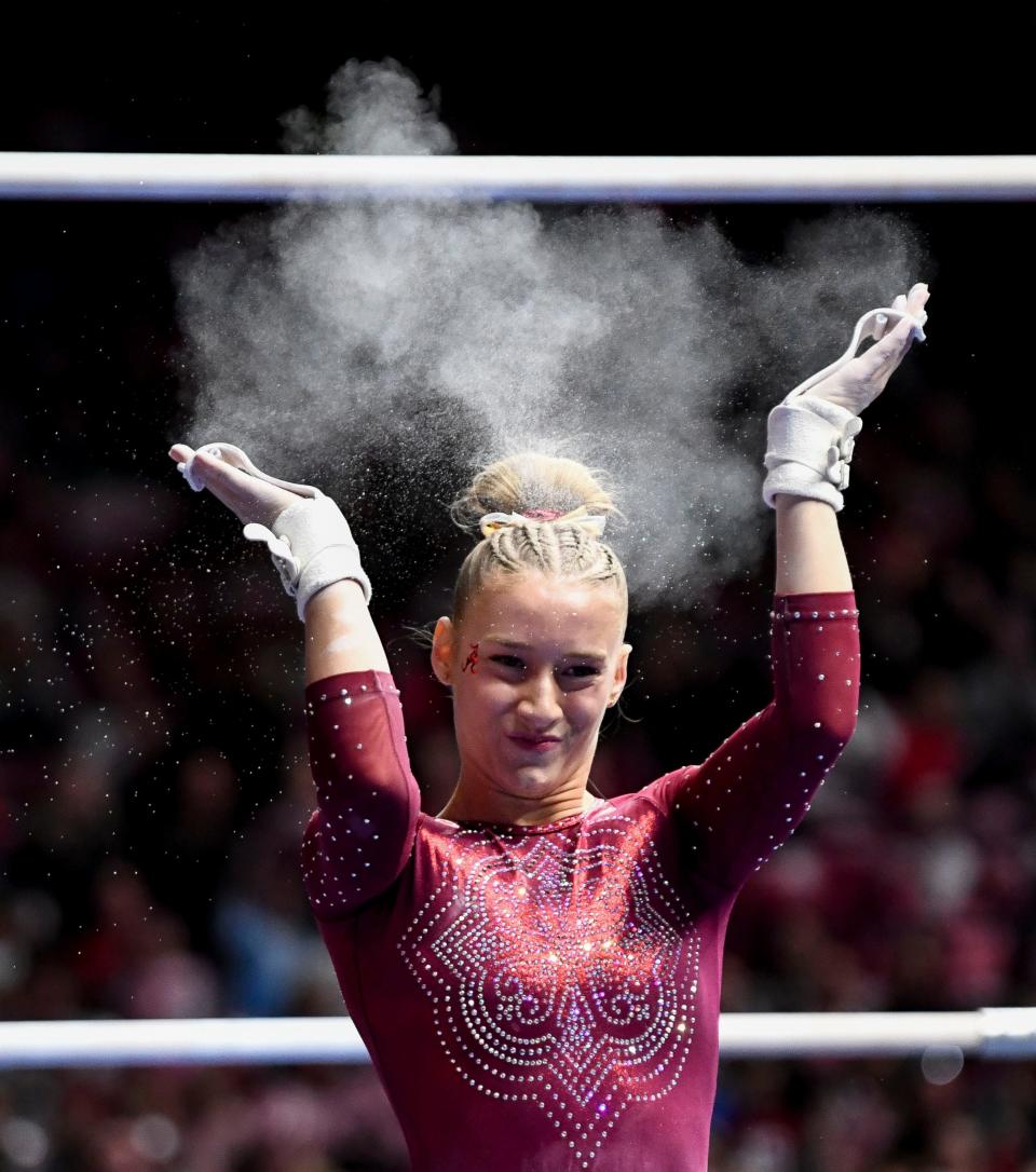 Jan 19, 2024; Tuscaloosa, AL, USA; Alabama gymnast Chloe LaCoursiere celebrates after her routine on the bars in Coleman Coliseum Friday. Alabama and Arkansas tied with scores of 197.525.