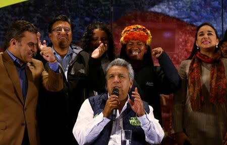 Lenin Moreno (C), presidential candidate of the ruling PAIS Alliance Party, gives a news conference accompanied by candidates for Ecuador's Assembly in Quito, Ecuador, February 20, 2017. REUTERS/Mariana Bazo