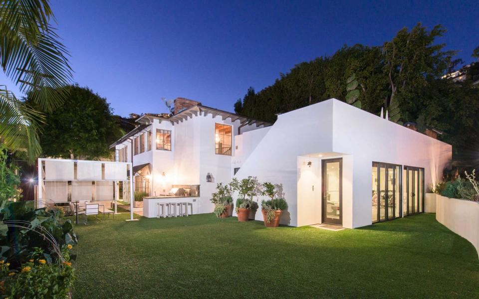 <p>Originally built in 1923, the home is a mashup of two of Hollywood's favorite styles: low-slung modernist home and Mediterranean stucco villa. Because, as we well know, the rich and famous don't settle for just one thing. </p>
