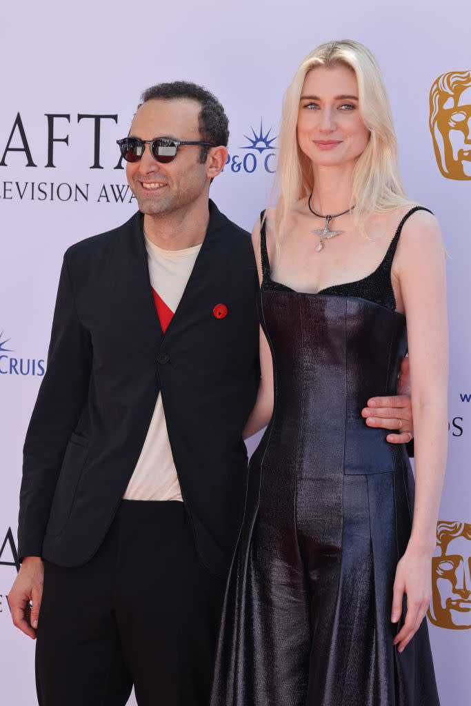 Elizabeth Debicki and Khalid Abdalla attend the 2024 BAFTA Television Awards on May 12 in London, Armani Privé, red carpet, exposed bra trend