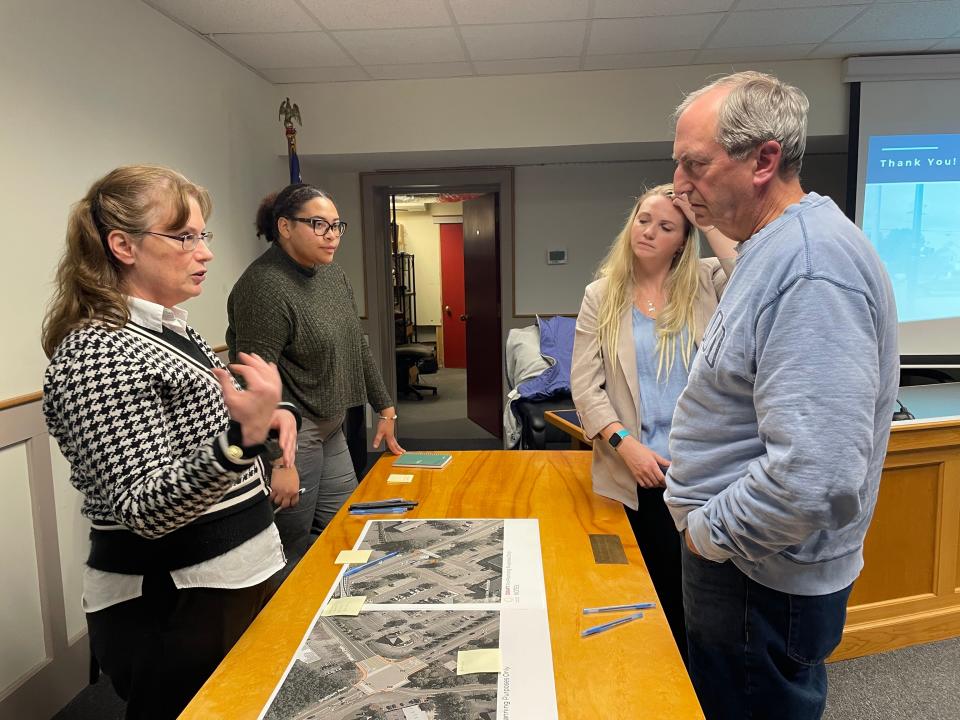 Yarmouth Town Planner Kathy Williams explains Station Avenue upgrade recommendations to Bill Glass, right, of South Yarmouth, with Town Engineer Amanda Lima, right, and Cape Cod Commission Transportation Planner Joyia Smikle at Wednesday’s public meeting at Yarmouth Town Hall in South Yarmouth. A total of 162 crashes have occurred from 2018 to 2020 at intersections along the one-mile corridor.