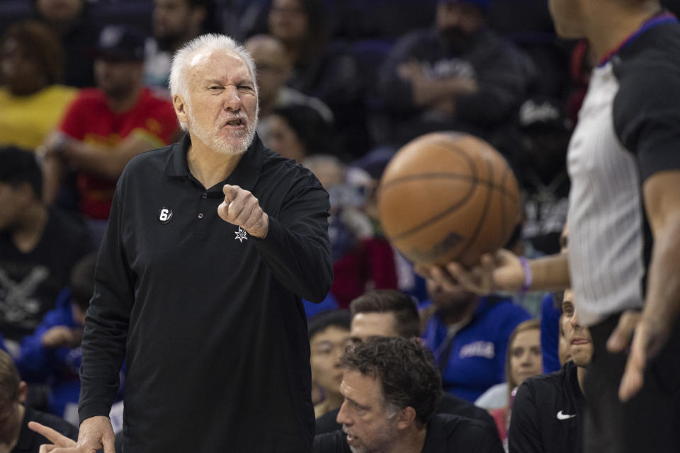 San Antonio Spurs head coach Greg Popovich shouts at a referee in the first half of an NBA basketball game against the Philadelphia 76ers, Saturday, Oct. 22, 2022, in Philadelphia. (AP Photo/Laurence Kesterson)