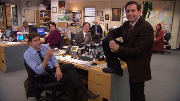 Michael puts his foot on Jim's desk