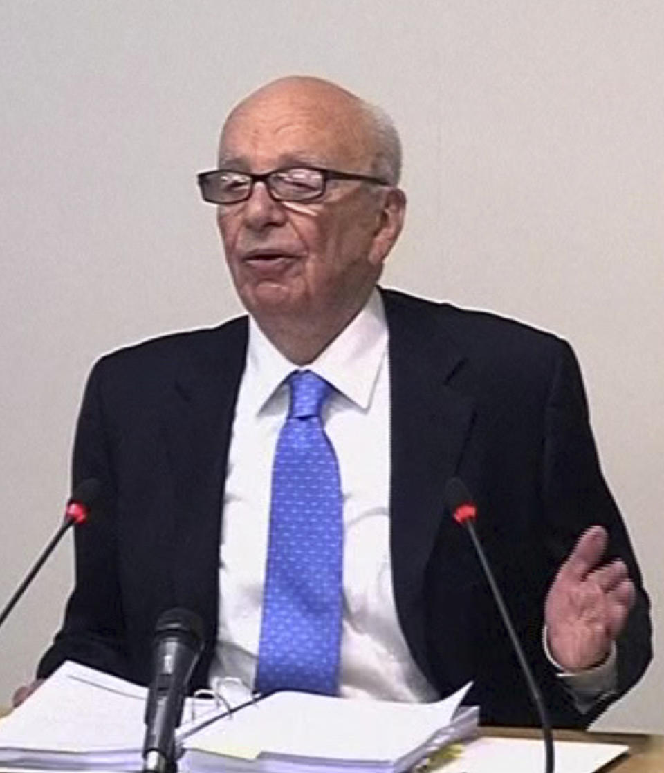 In this image from video, News Corp. chairman Rupert Murdoch appears at Lord Justice Brian Leveson's inquiry in London, Wednesday April 25, 2012 to answer questions under oath about how much he knew about phone hacking at the News of the World tabloid. Murdoch is being grilled on his relationship with British politicians at the country's media ethics inquiry, while a government minister is battling accusations he gave News Corp. privileged access in its bid to take over a major broadcaster. (AP Photo/Pool)