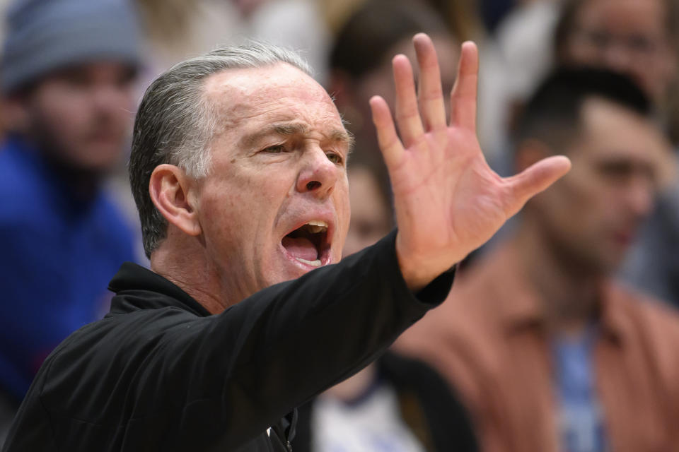 TCU head coach Jamie Dixon yells to his team during the second half of an NCAA college basketball game against Kansas in Lawrence, Kan., Saturday, Jan. 6, 2024. (AP Photo/Reed Hoffmann)