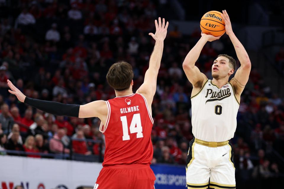 Purdue Boilermakers forward Mason Gillis rises to shoot as Wisconsin Badgers forward Carter Gilmore defends during the first half of a March 16 NCAA game.