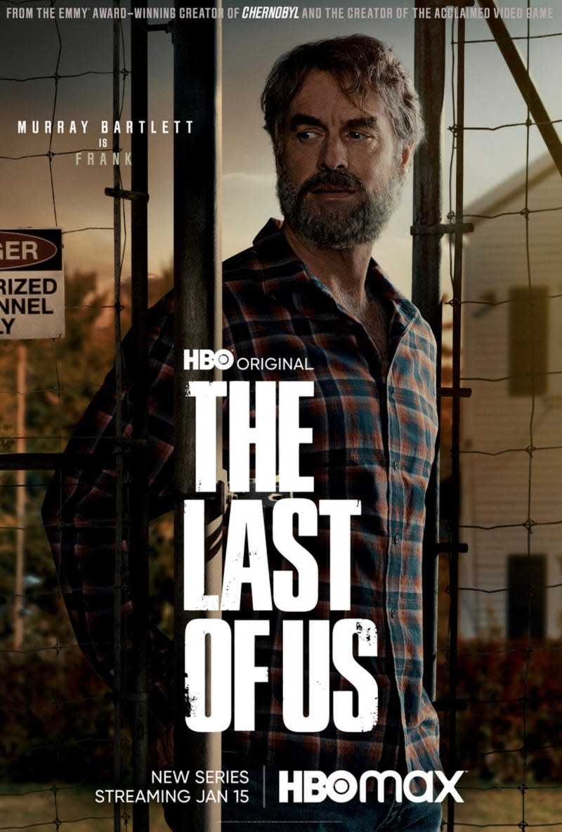 Actor Murray Bartlett as Frank is shown near a chain link fence in a poster image promoting the series The Last of Us.