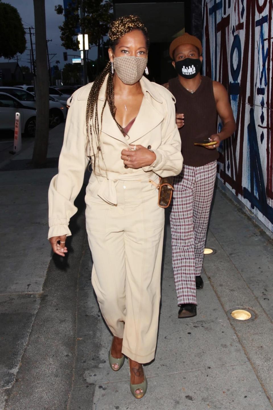 <p>Regina King shows off her street style in a tan jumpsuit and gingham face mask as she heads to dinner with friends at Craig’s in West Hollywood on Wednesday.</p>