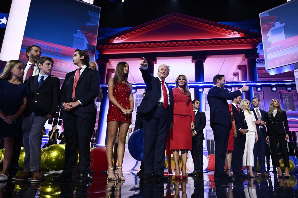 Former President and 2024 Republican presidential candidate Donald Trump gestures next to former first lady Melania Trump onstage during the last day of the 2024 Republican National Convention at the Fiserv Forum in Milwaukee, Wisconsin, on July 18, 2024. Donald Trump will get a hero's welcome Thursday as he accepts the Republican Party's nomination to run for president in a speech capping a convention dominated by the recent attempt on his life.