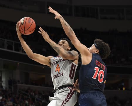 Mar 24, 2019; San Jose, CA, USA; Virginia Tech Hokies guard Nickeil Alexander-Walker (4) shoots against Liberty Flames guard Elijah Cuffee (10) during the second half in the second round of the 2019 NCAA Tournament at SAP Center. Mandatory Credit: Kelley L Cox-USA TODAY Sports