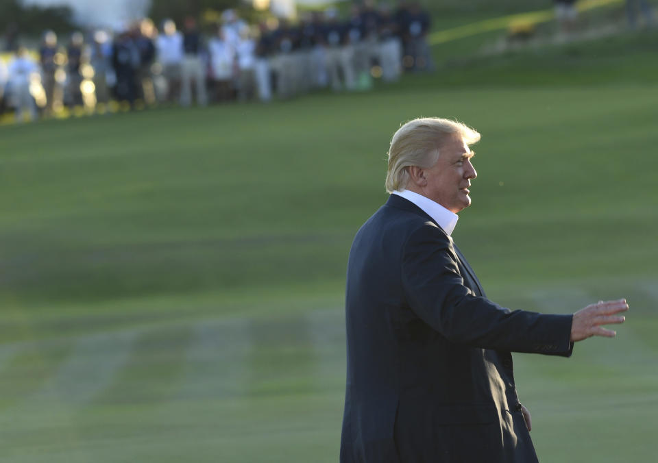 President Donald Trump walks on the course before he presented the United States team with the Presidents Cup at the Jersey City Golf Club in New Jersey.&nbsp; (Photo: ASSOCIATED PRESS)