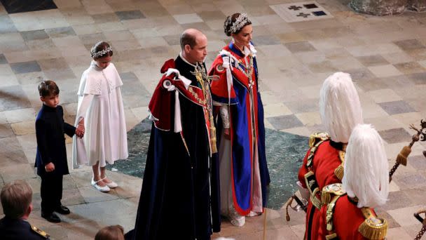 PHOTO: Britain's Prince William and Kate, Princess of Wales, followed by Princess Charlotte and Prince Louis, arrive for the coronation of King Charles III at Westminster Abbey, London, May 6, 2023. (Phil Noble/AP)