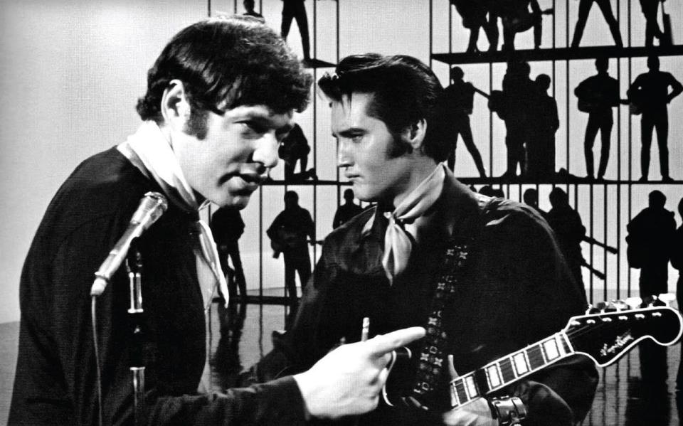 FILE - Elvis Presley, right, and director/producer Steve Binder, left, on the set of Presley's televised 1968 comeback special. The backstory of this special will be explored in "Reinventing Elvis: The '68 Comeback."