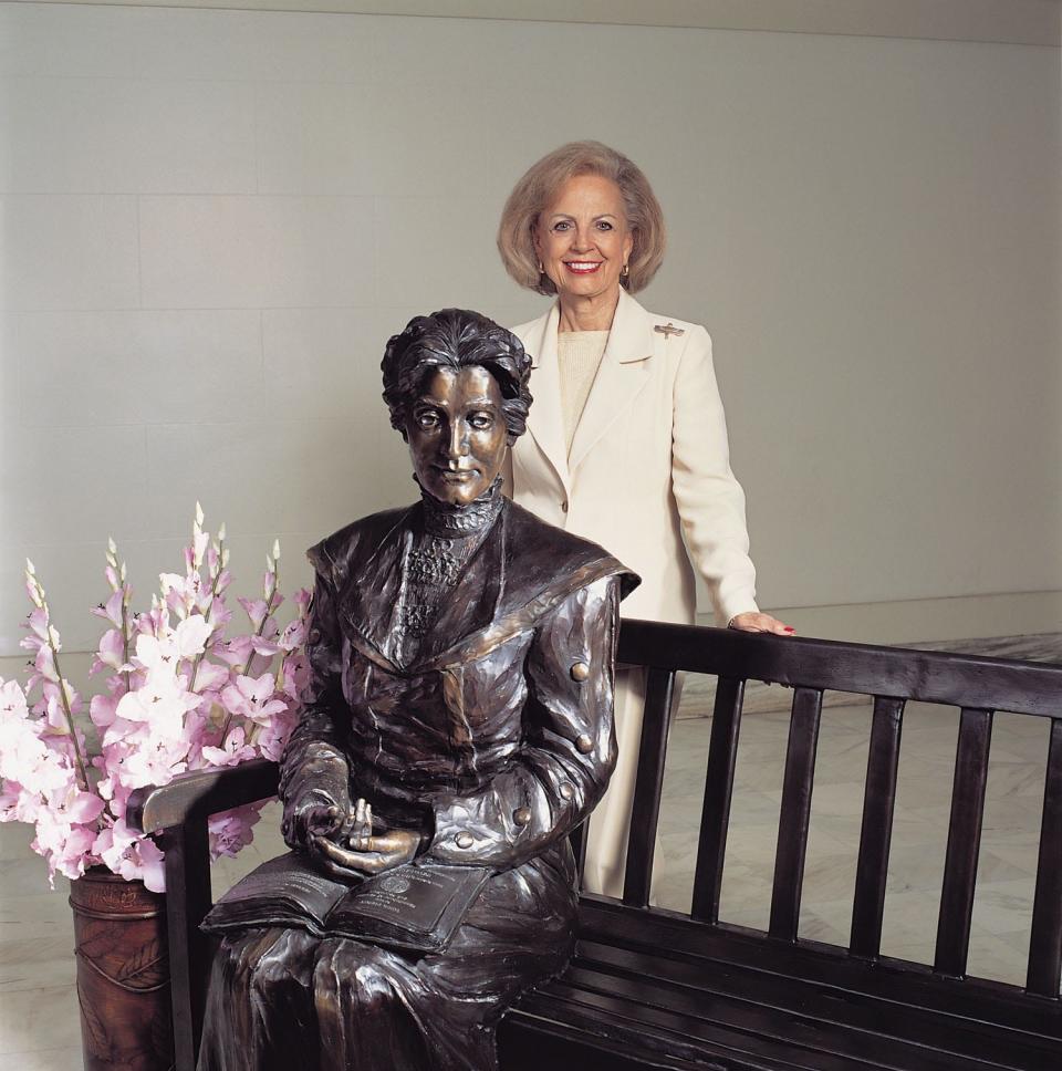 Oklahoma Arts Council Executive Director Betty Price poses with the sculpture of Kate Barnard, the first woman to be elected to state office in Oklahoma, inside the state Capitol. Price, who retired in 2007 after 33 years of service with the state Arts Council, died Oct. 23 at the age of 92.