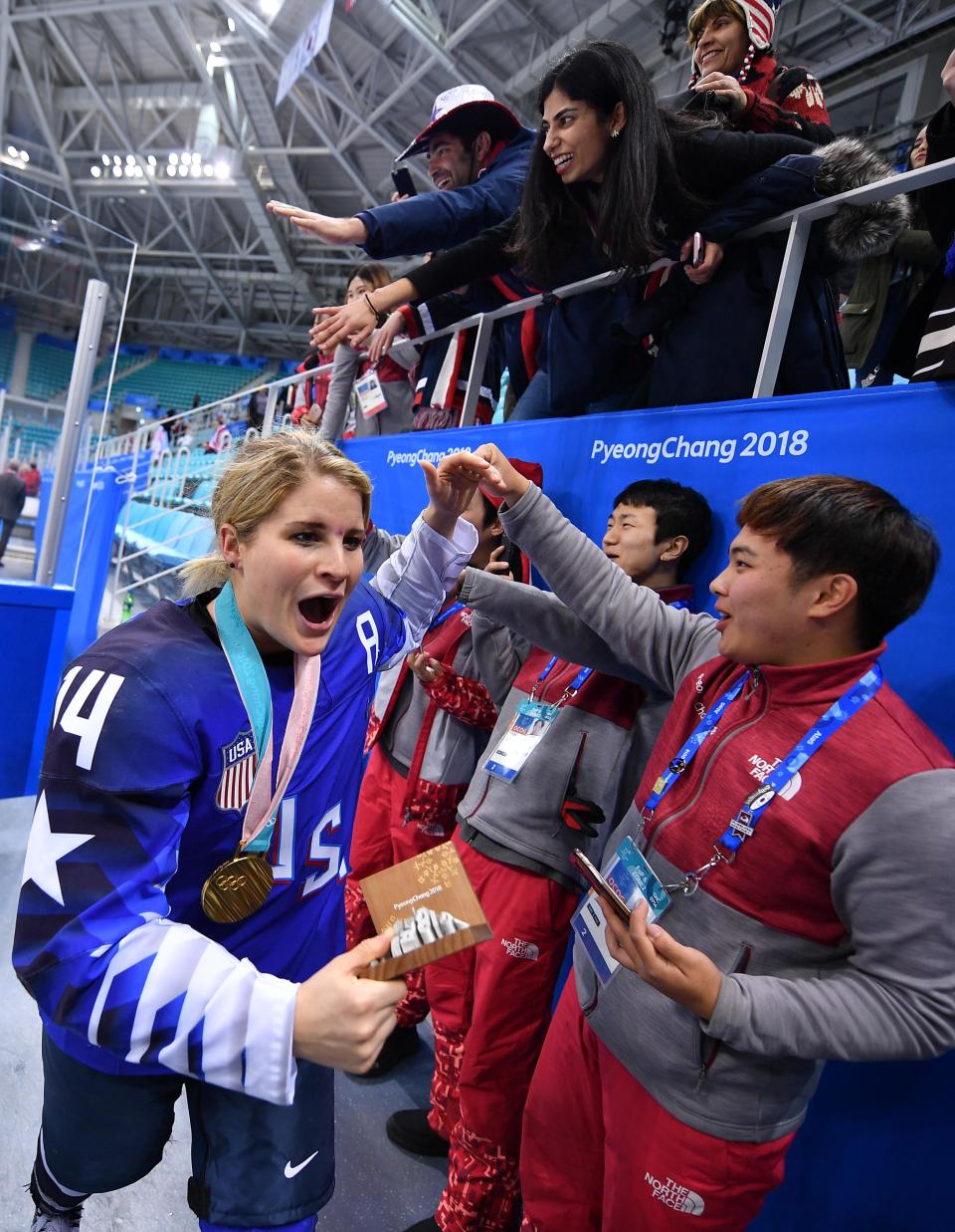 U.S. forward Brianna Decker celebrates with fans after defeating Canada in the women's ice hockey gold medal match during the Pyeongchang 2018 Olympic Winter Games at Gangneung Hockey Centre.