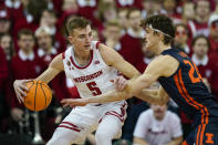 Wisconsin's Tyler Wahl (5) drives against Illinois's Matthew Mayer during the first half of an NCAA college basketball game, Saturday, Jan. 28, 2023, in Madison, Wis. (AP Photo/Andy Manis)