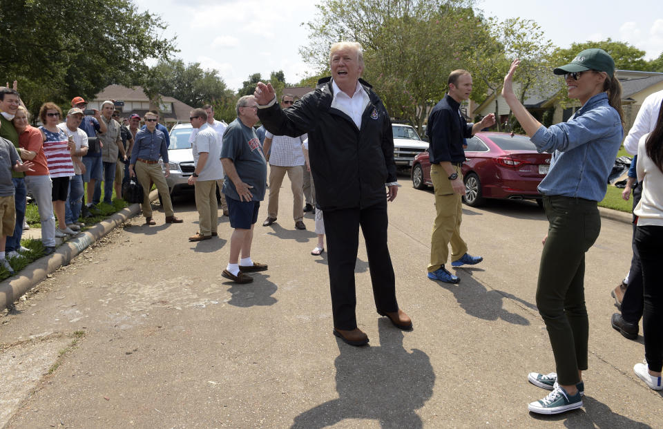 <p>President Donald Trump and first lady Melania Trump stop to talk with residents impacted by Hurricane Harvey in a Houston neighborhood, Saturday, Sept. 2, 2017. (Photo: Susan Walsh/AP) </p>