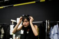 Japanese model Rina Fukushi prepares back stage for the Tae Ashida 2017 Spring/Summer collection show by designer Tae Ashida in Tokyo