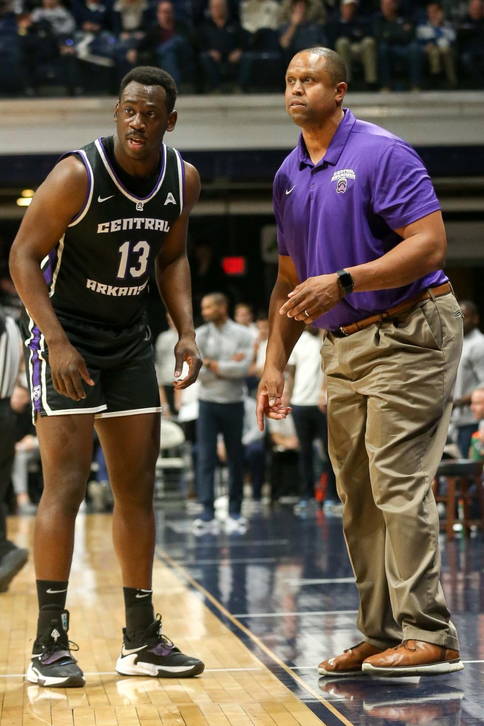 Central Arkansas coach Anthony Boone (right) gives instructions to playerEddy Kayouloud during a November game at Butler. Boone played at Ole Miss with Florida Gators coach Mike White, and he brings the Bears to Jacksonville this week to play UNF and JU.