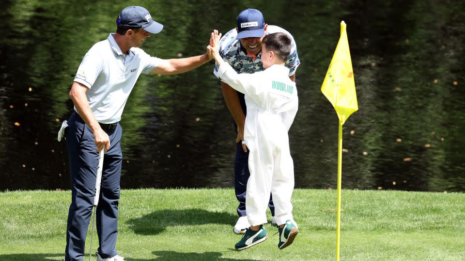 Jax Woodland is congratulated on his putt. - Warren Little/Getty Images