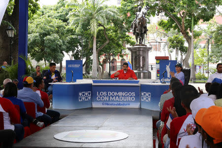 Venezuela's President Nicolas Maduro (C) speaks during his weekly broadcast "Los Domingos con Maduro" (The Sundays with Maduro) in Caracas, Venezuela July 23, 2017. Miraflores Palace/Handout via REUTERS