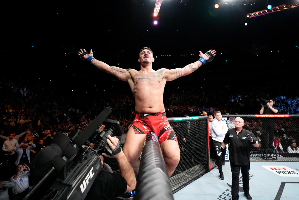 LONDON, ENGLAND - MARCH 19:  Tom Aspinall of England celebrates his submission victory over Alexander Volkov of Russia in a heavyweight fight during the UFC Fight Night event at O2 Arena on March 19, 2022 in London, England. (Photo by Chris Unger/Zuffa LLC)