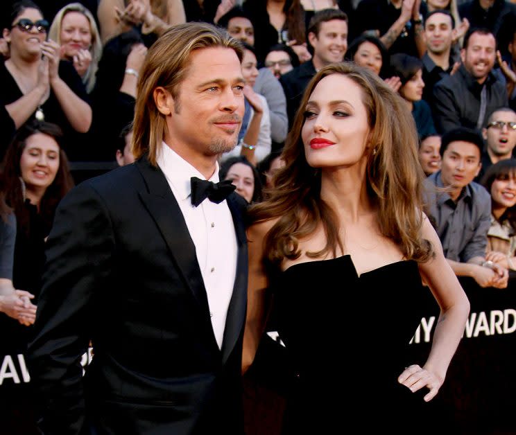 HOLLYWOOD, CA - FEBRUARY 26: Actors Brad Pitt (L) and Angelina Jolie arrive at the 84th Annual Academy Awards held at Hollywood & Highland Centre on February 26, 2012 in Hollywood, California. (Photo by Dan MacMedan/WireImage)