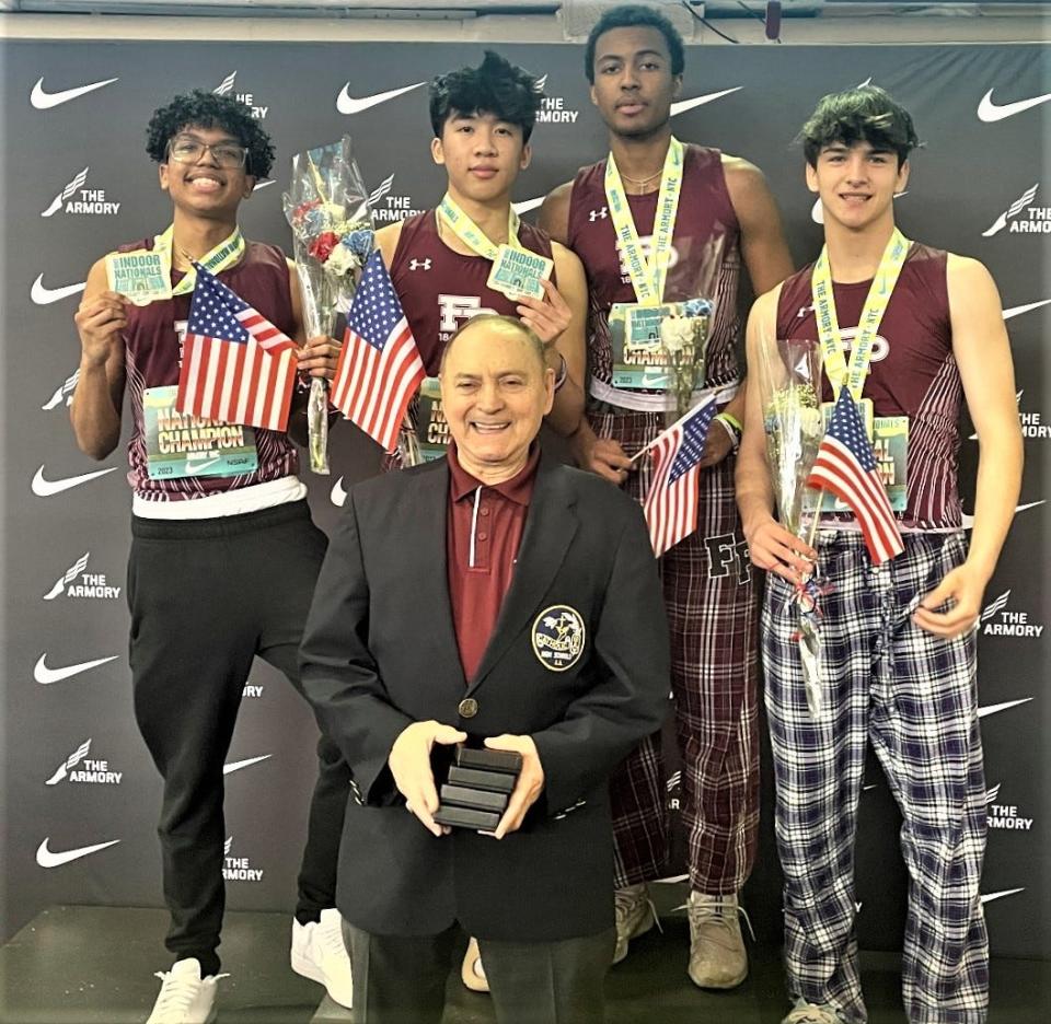 The gold medal-winning Fordham Prep shuttle hurdle relay team with coach Ignacio G. Febles of Yonkers at the 2023 Nike Indoor Nationals track and field championships at The Armory