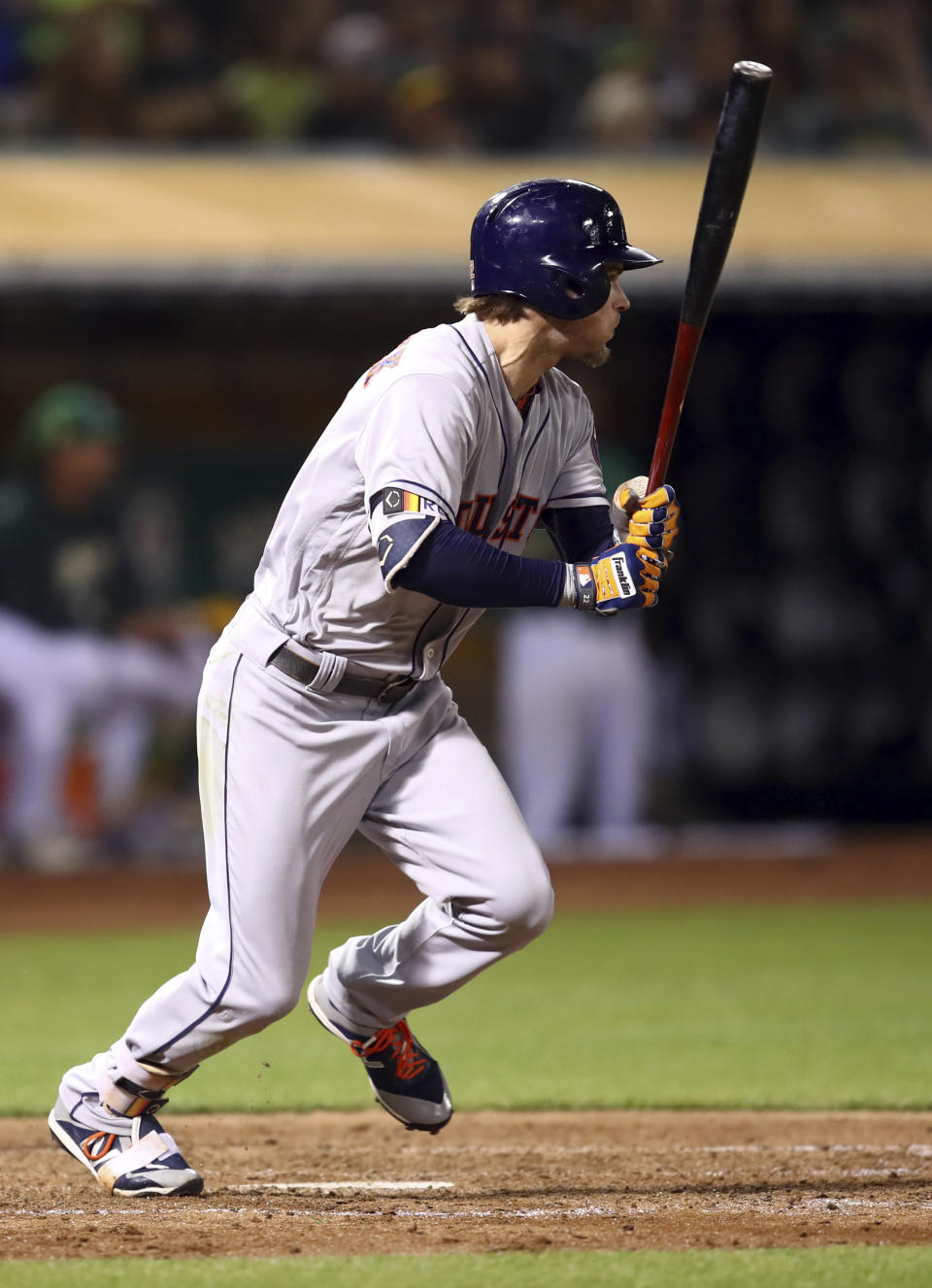 Houston Astros' Josh Reddick watches his RBI single against the Oakland Athletics during the sixth inning of a baseball game Friday, Aug. 17, 2018, in Oakland, Calif. (AP Photo/Ben Margot)