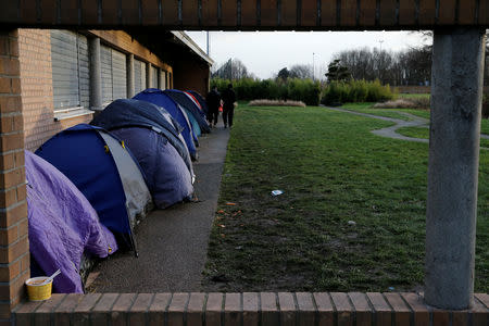 Tents are seen in front of a gymnasium, used as a migrants shelter, in Grande-Synthe, France, January 9, 2019. Picture taken January 9, 2019. REUTERS/Pascal Rossignol