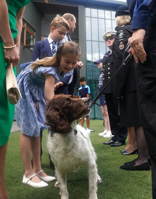 Charlotte petting police dog