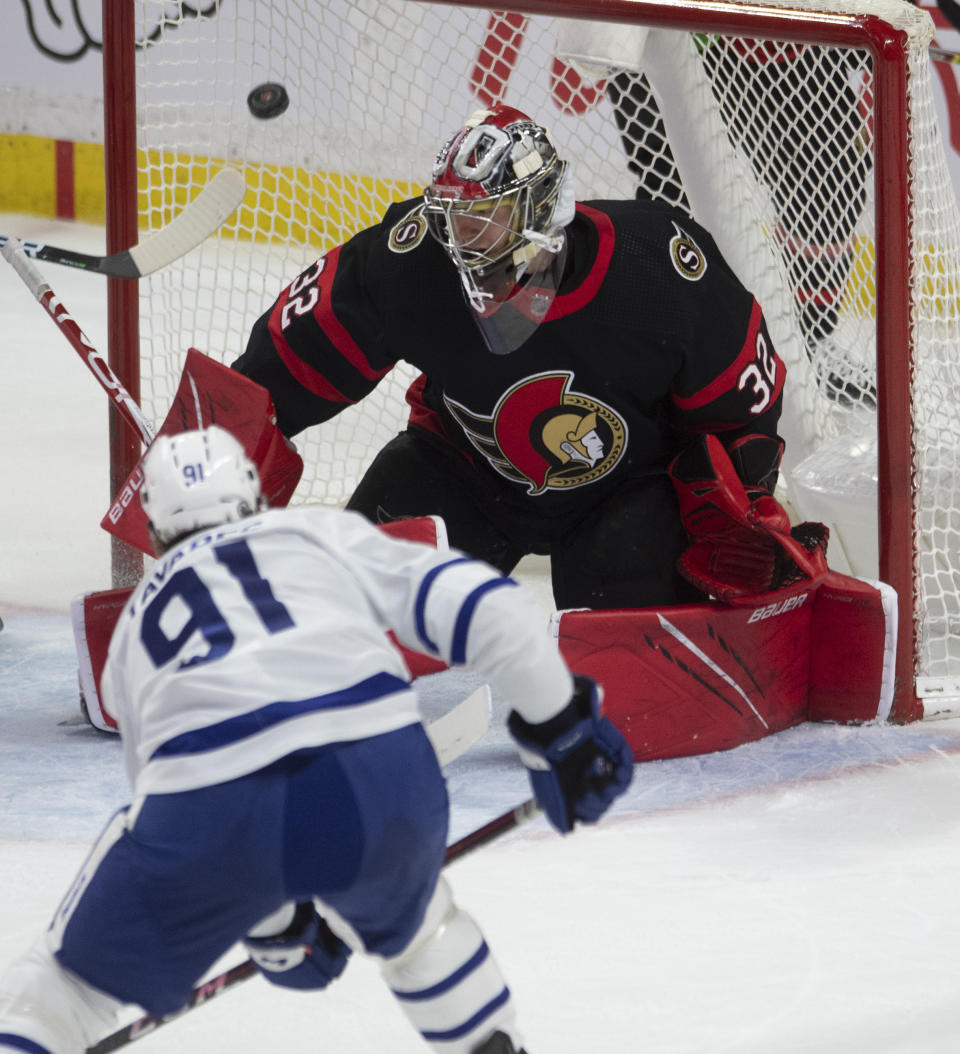 Toronto Maple Leafs center John Tavares scores on Ottawa Senators goaltender Anton Forsberg during the second period of an NHL hockey game Wednesday, May 12, 2021, in Ottawa, Ontario. (Adrian Wyld/The Canadian Press via AP)