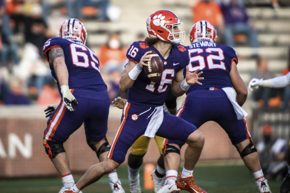 Clemson quarterback Trevor Lawrence (16) looks to make a pass during the first half of an NCAA college football game against Pittsburgh Saturday, Nov. 28, 2020, in Clemson, S.C. (Ken Ruinard/The Independent-Mail via AP, Pool)