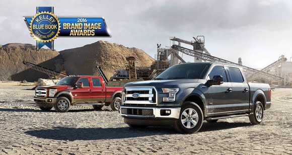 Two Ford F-150 trucks at a quarry with an award logo at upper left.