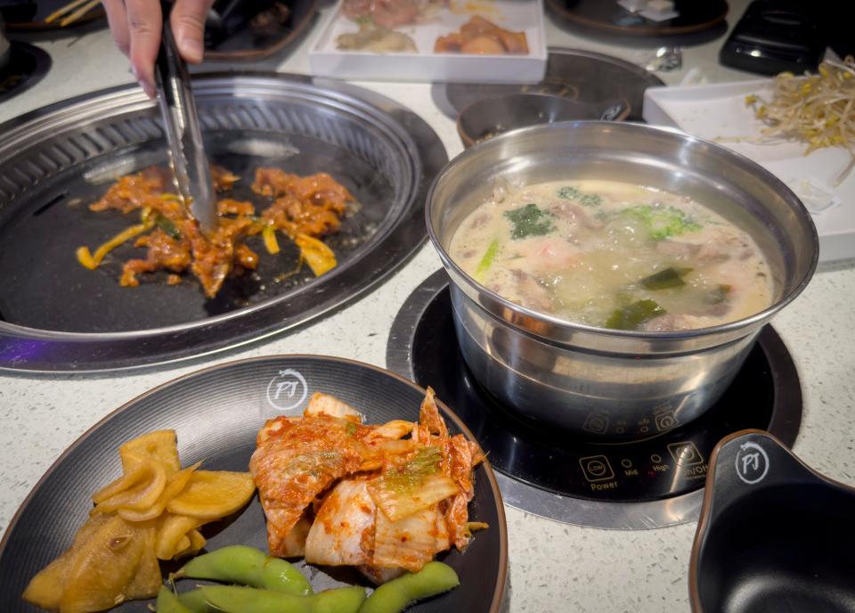 In the hot pot, diners are served a broth base and can add ingredients like meat and veggies as they wish.