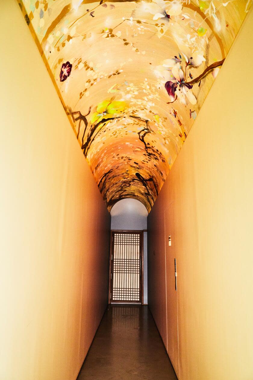 The hallway between the Banchan Shop and Meju in features an art piece by Suzy Taekyung Kim.