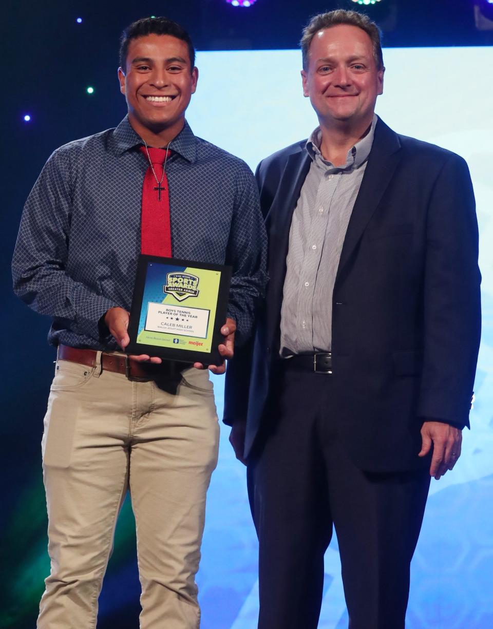 Walsh Jesuit's Caleb Miller Greater Akron Boys Tennis Player of the Year with Michael Shearer Akron Beacon Journal editor at the High School Sports All-Star Awards at the Civic Theatre in Akron on Friday.