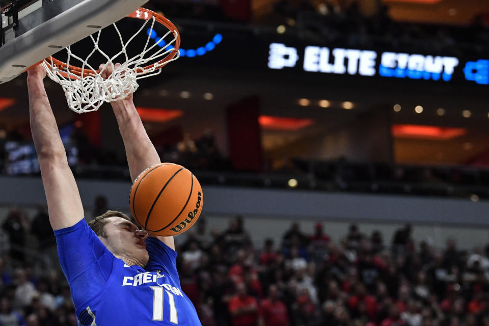 Creighton center Ryan Kalkbrenner (11) dunks the ball against San Diego State in the second half of a Elite 8 college basketball game in the South Regional of the NCAA Tournament, Sunday, March 26, 2023, in Louisville, Ky. (AP Photo/Timothy D. Easley)