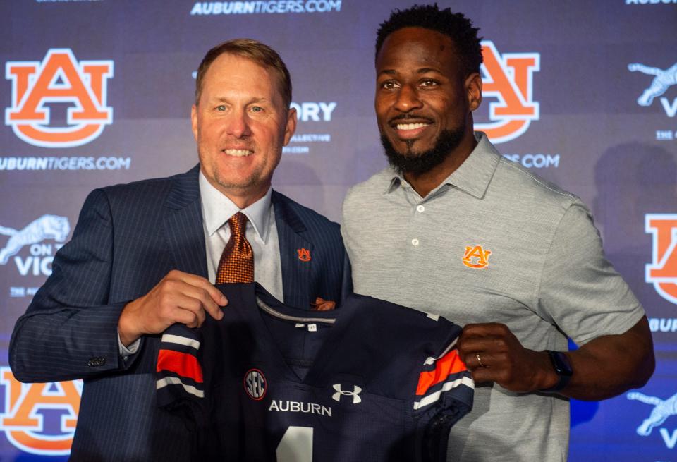 Auburn Tigers football coach Hugh Freeze poses with associate head coach Cadillac Williams at the Woltosz Football Performance Center in Auburn, Ala., on Tuesday, Nov. 29, 2022