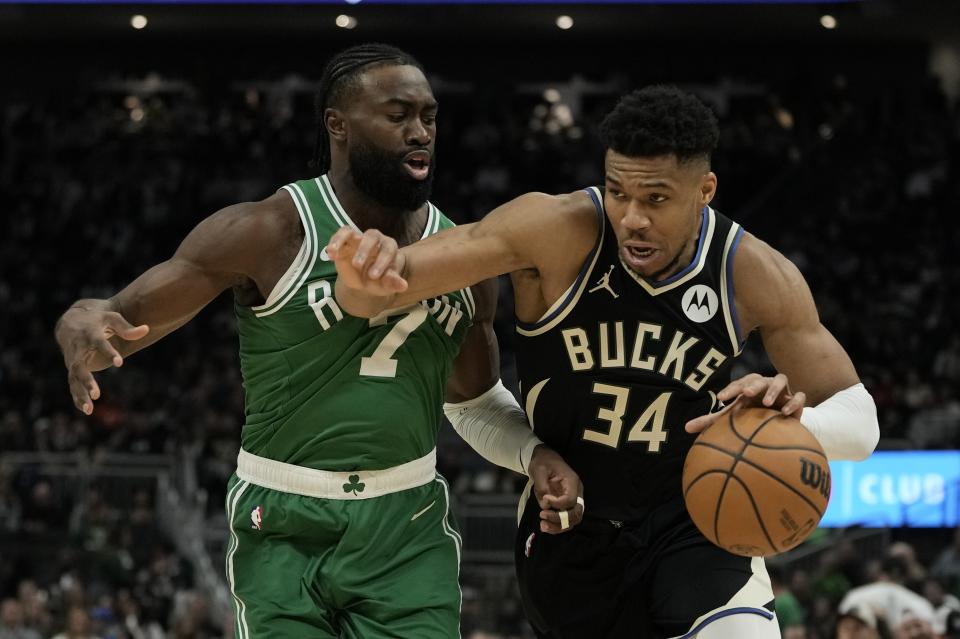 Milwaukee Bucks' Giannis Antetokounmpo gets past Boston Celtics' Jaylen Brown during the second half of an NBA basketball game Tuesday, April 9, 2024, in Milwaukee. The Bucks won 104-91. (AP Photo/Morry Gash)