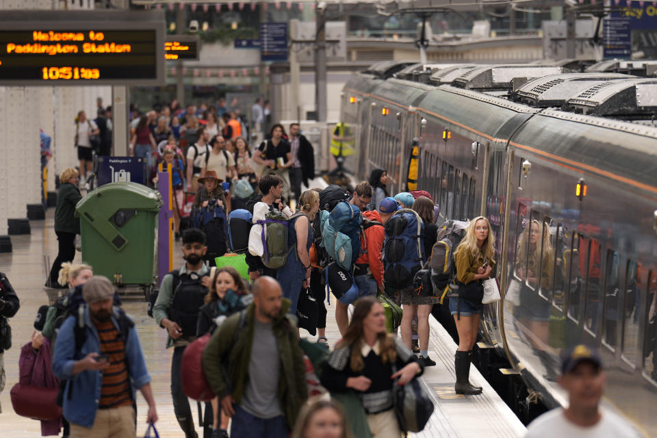 Passengers with camping equipment board a train to go to the Glastonbury music festival at Paddington railway station, in London, during a railway workers strike, Thursday, June 23, 2022. Tens of thousands of railway workers walked off the job in Britain on Tuesday, bringing the train network to a crawl in the country's biggest transit strike for three decades. Britain faces the second of three national railway strikes Thursday after new negotiations between union and employers ended in deadlock. The Rail, Maritime and Transport Union accused the government of "wrecking" Wednesday's talks and said the 24-hour walkout by 40,000 cleaners, signalers, maintenance workers and station staff would go ahead as planned. The union's action this week is Britain's biggest and most disruptive railway strike for 30 years. (AP Photo/Matt Dunham)