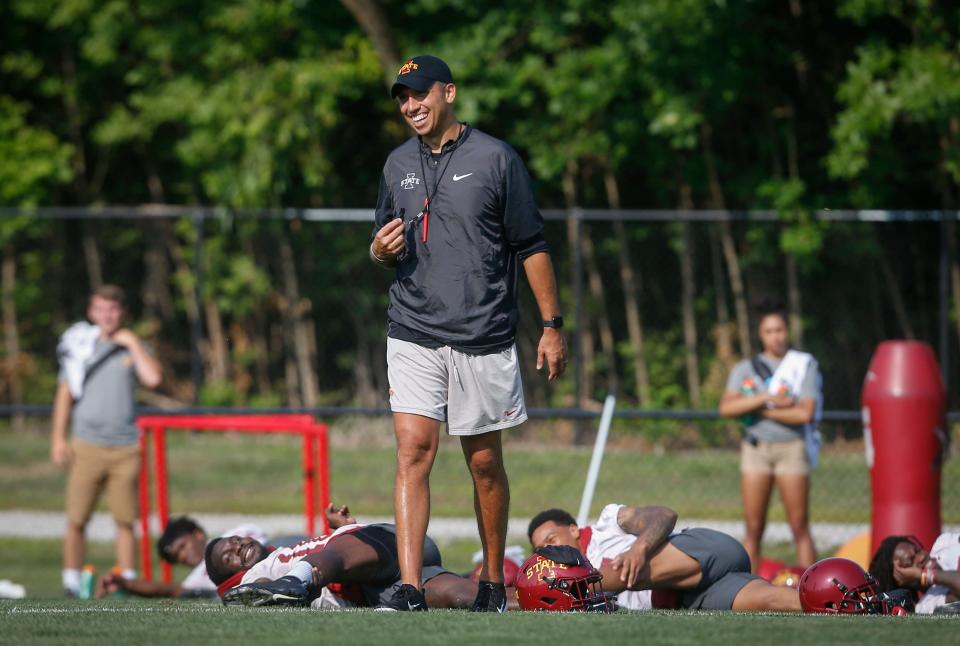 Iowa State head football coach Matt Campbell keeps the mood light as his team warms up prior to an open practice on Aug. 3, 2018.