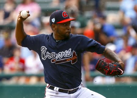 FILE PHOTO: Mar 4, 2019; Lake Buena Vista, FL, USA; Atlanta Braves starting pitcher Julio Teheran (49) throws a pitch as rain begins to fall during the first inning of a game against the Houston Astros at Champion Stadium. Mandatory Credit: Butch Dill-USA TODAY Sports