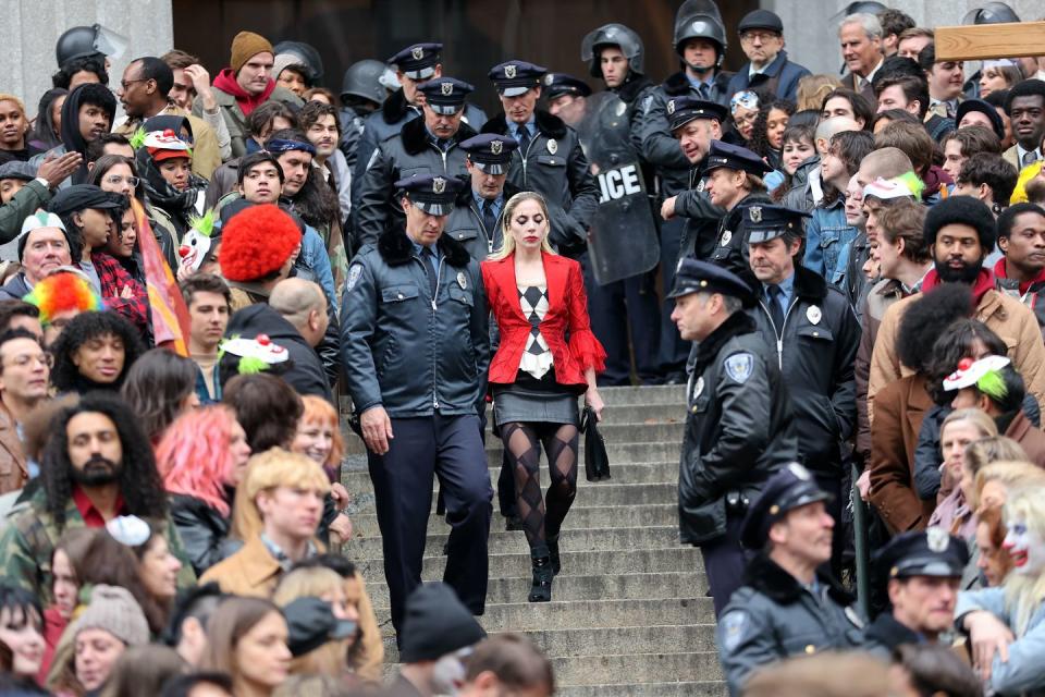 lady gaga as harley quinn filming with a crowd around her