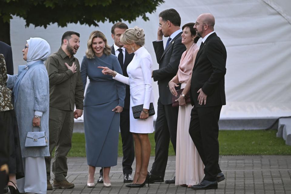 Ukrainian President Volodymyr Zelenskyy, second left and his wife Olena Zelenska speak with French President Emmanuel Macron’s wife Brigitte Macron, ahead of a dinner, during the NATO Summit in Vilnius, Lithuania, Tuesday, July 11, 2023. | Paul Ellis, pool photo via Associated Press