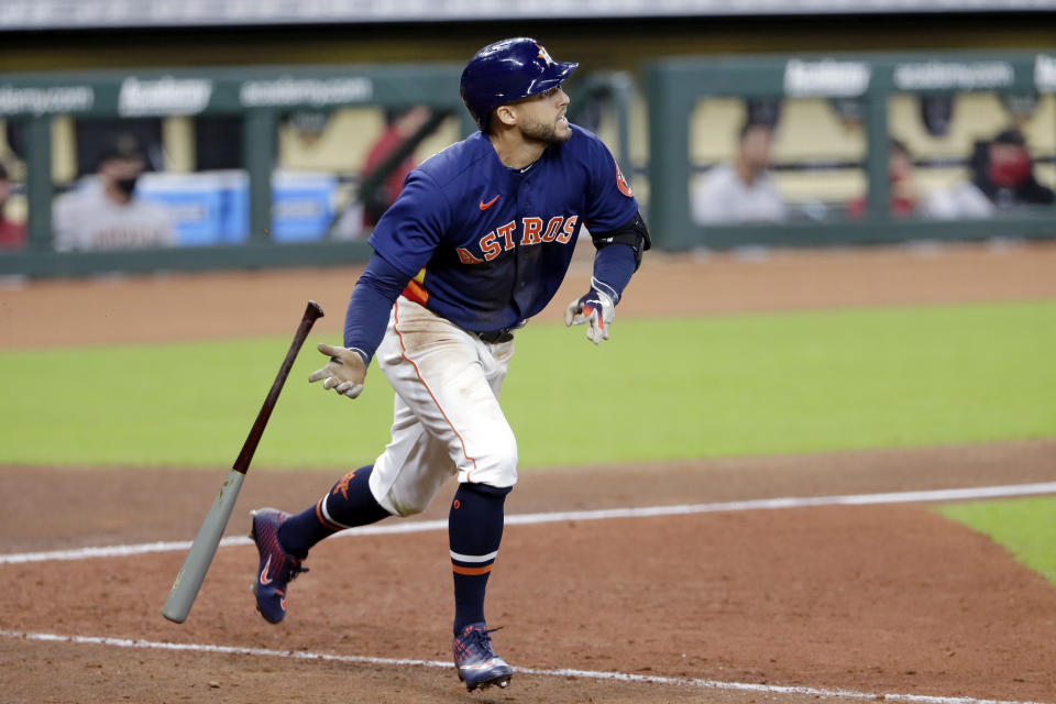 Houston Astros' George Springer flips his bat as he watches his second home run ball during the seventh inning of a baseball game against the Arizona Diamondbacks Sunday, Sept. 20, 2020, in Houston. (AP Photo/Michael Wyke)