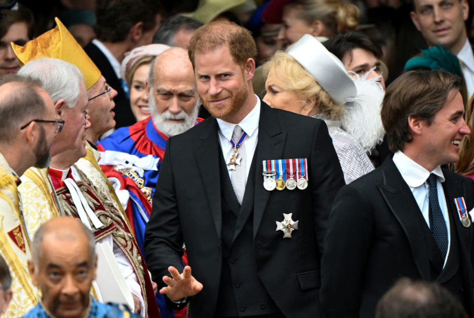 Prince Harry looks jovial as he arrives at his father's coronation. (Getty Images)