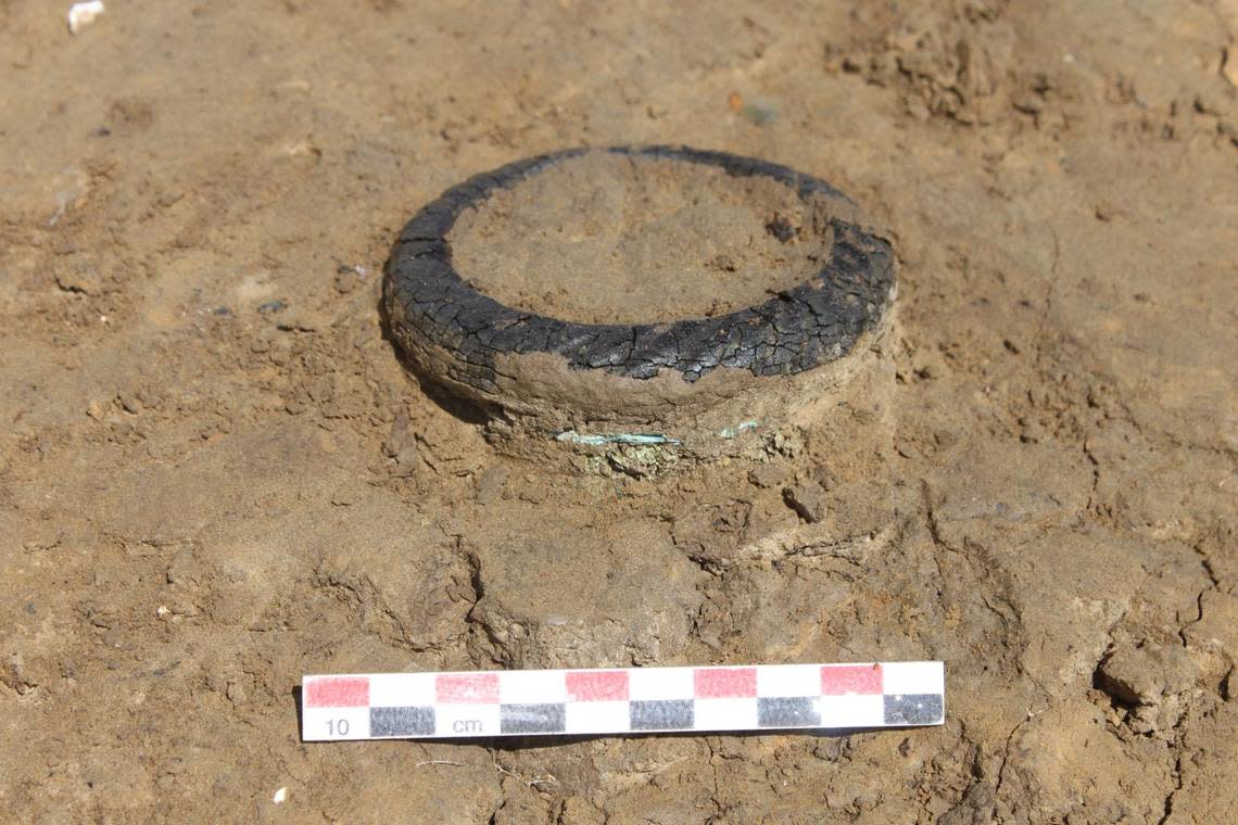 The woman was wearing two bracelets on her left arm, archaeologists said.