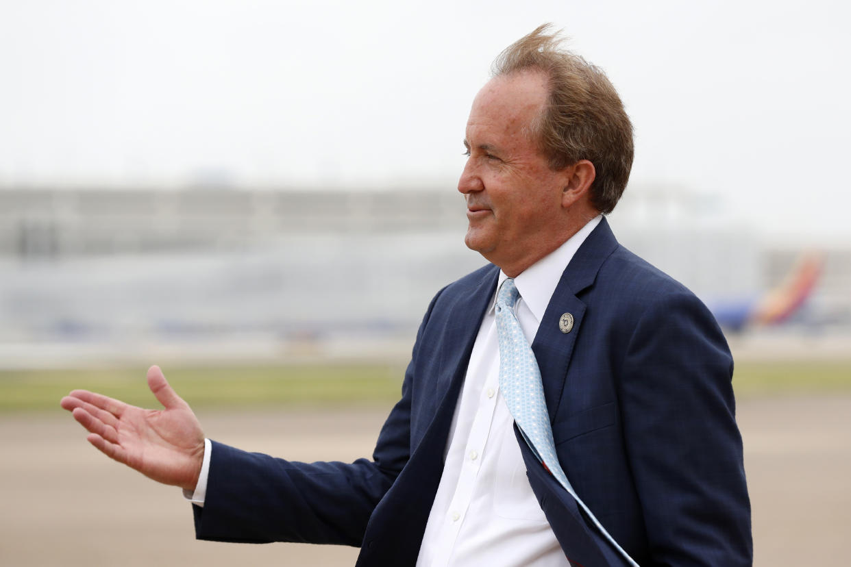 FILE - In this June 28, 2020, file photo, Texas State Attorney General Ken Paxton waits on the flight line for Vice President Mike Pence to arrive in Dallas. The Texas bar association has opened an investigation into whether Paxton's failed efforts to overturn the 2020 presidential election amounted to professional misconduct. After Paxton, a Republican, petitioned the U.S. Supreme Court in December to block Joe Biden's victory, a Democratic Party activist filed a complaint with the bar association calling the case frivolous. The bar initially declined to investigate, but a tribunal overturned that decision late last month. (AP Photo/Tony Gutierrez, File)